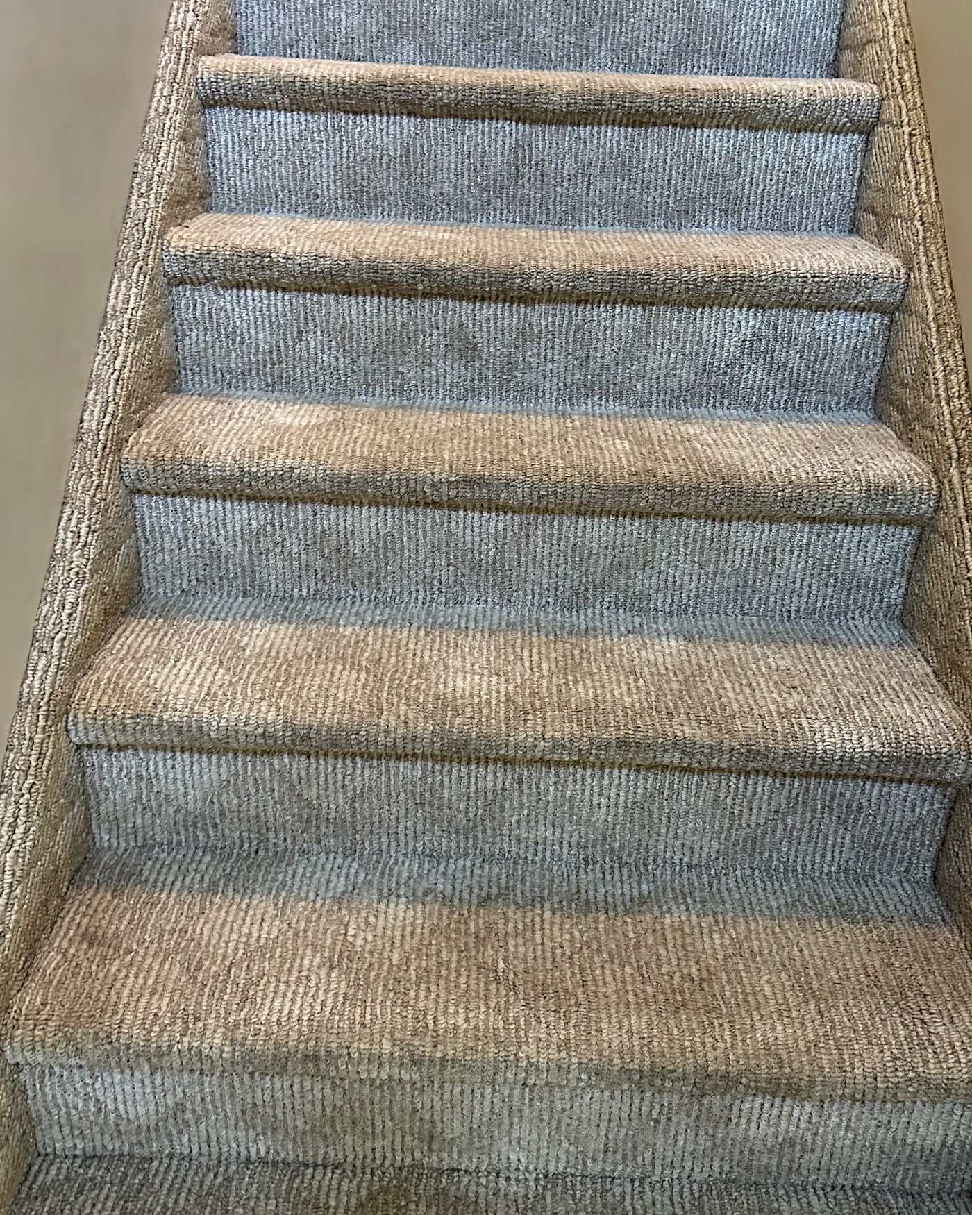 The same staircase after cleaning, the oatmeal and blue-grey banding even again